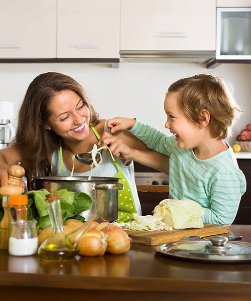 mom and son in the kitchen eating
